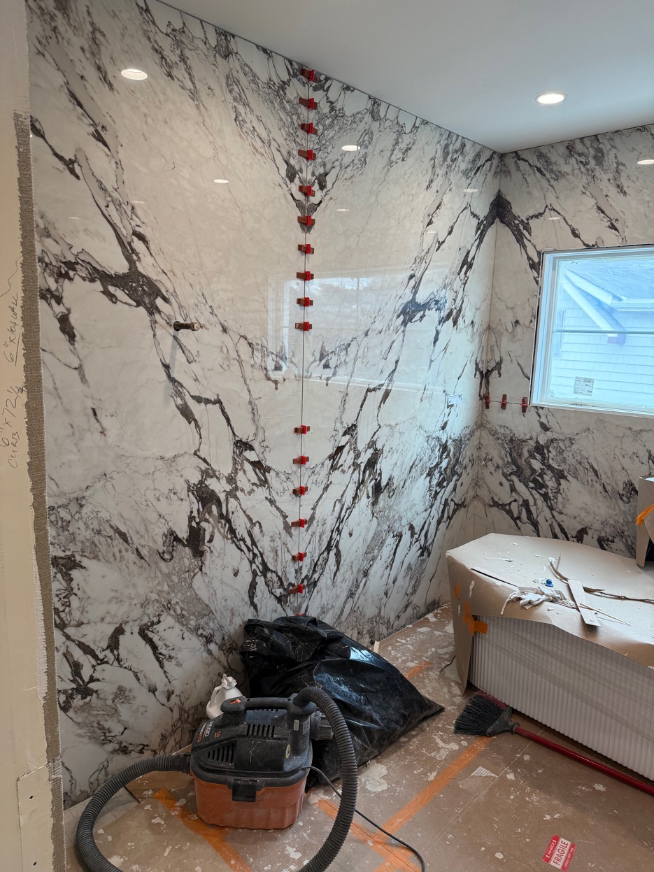Marble shower surround installation in progress Chicago suburbs