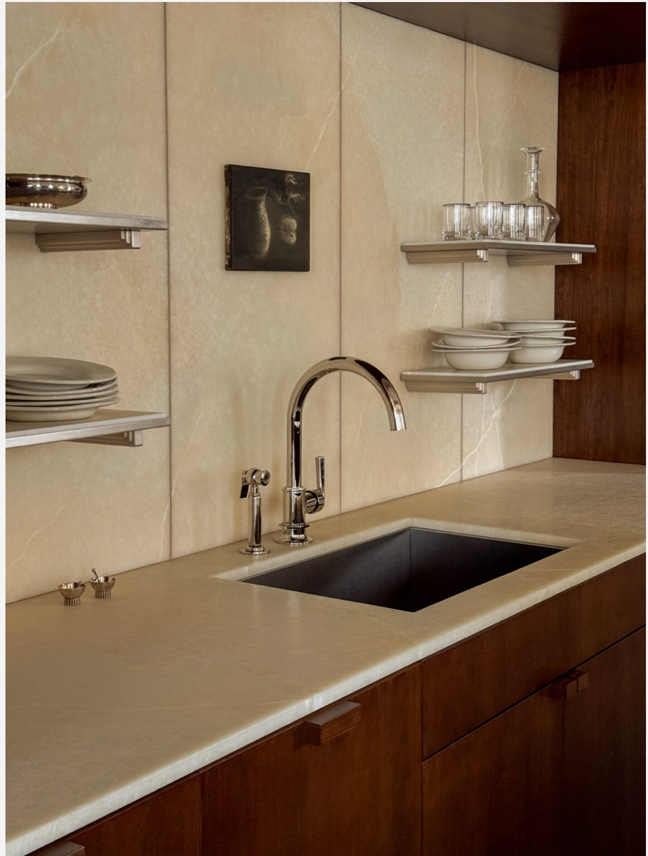 Warm stone kitchen countertop backsplash dark wood Chicago