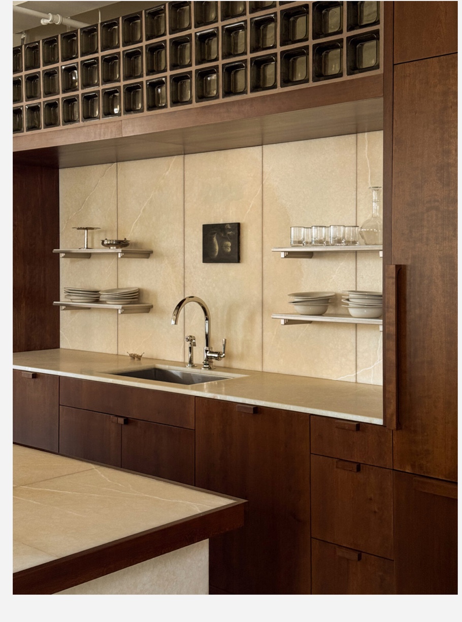 Warm limestone kitchen full view dark walnut cabinets Chicago