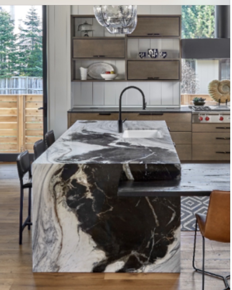 Black and white dramatic marble waterfall island kitchen Chicago