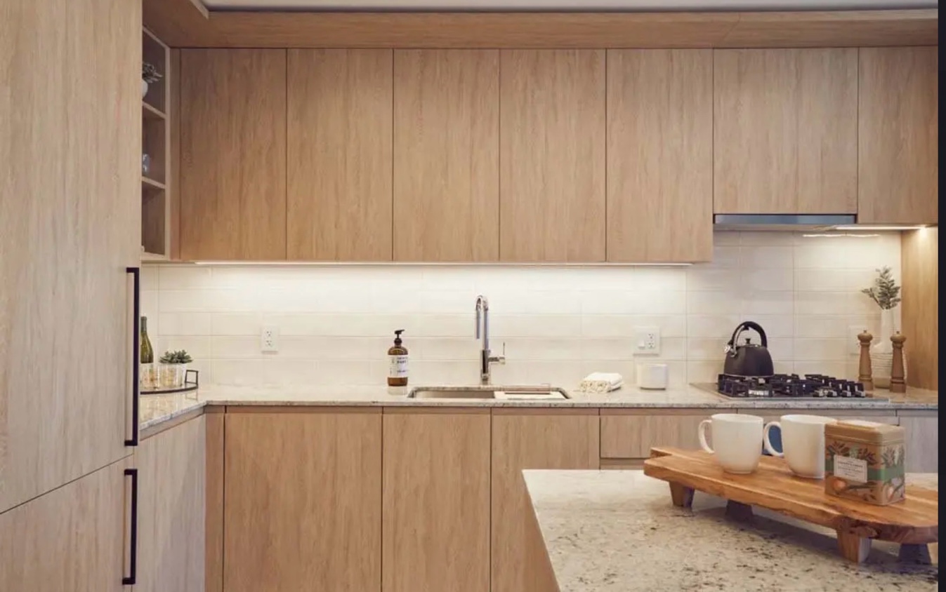 Modern kitchen warm wood cabinets granite countertops