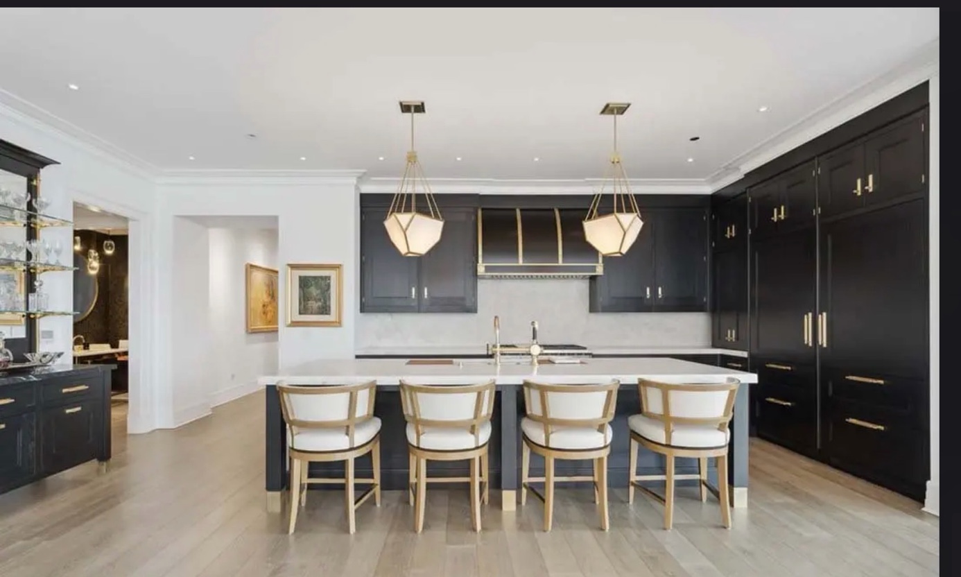 Dark kitchen white stone countertops gold fixtures Chicago