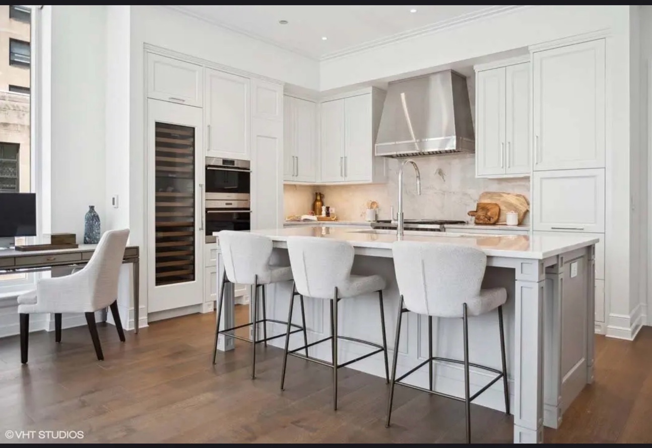 White kitchen marble island wine fridge Chicago