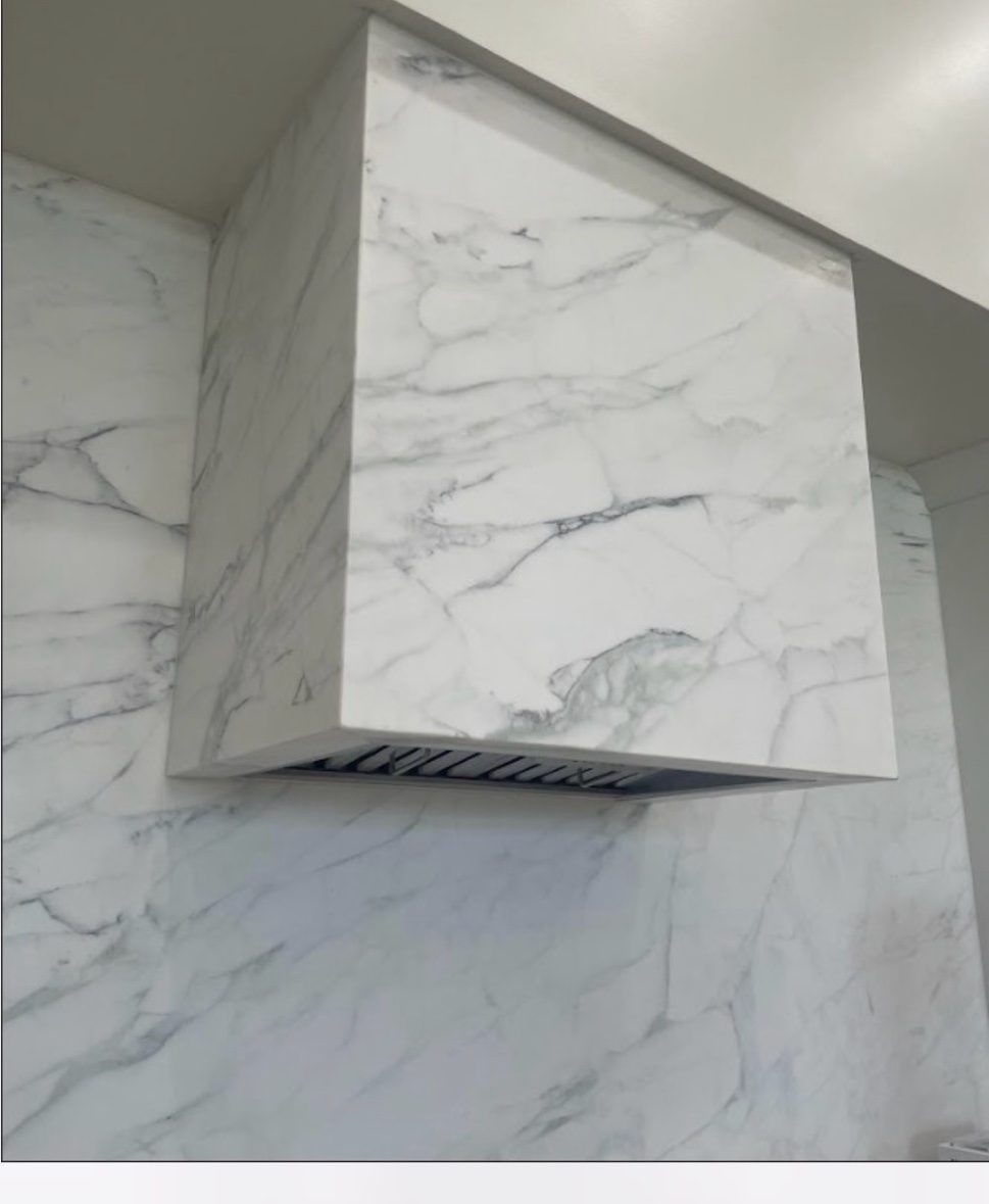 Marble hood surround and backsplash freshly installed kitchen Chicago