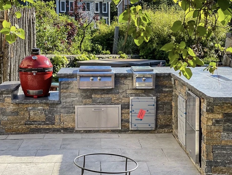 Outdoor kitchen stone countertops Kamado grill Chicago suburbs
