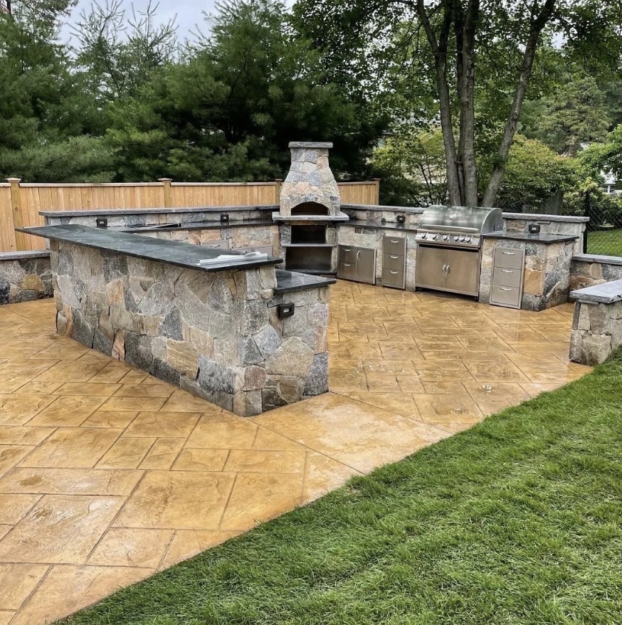 Outdoor kitchen granite countertops stone base pizza oven Chicago